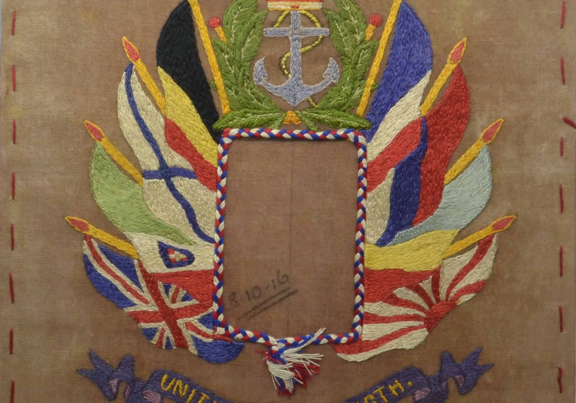 WW1 10 F5799 Embrodery - Flags of allied nations surmounted by anchor over motto Unity is strength 3.10.16 close-up